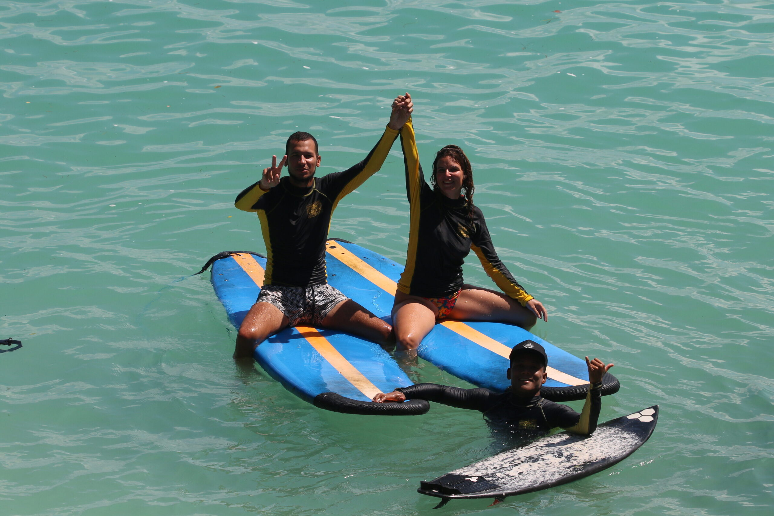 Surf instructor with student during semi-private lesson in Bali